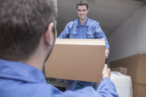 Professional removals team managing a move in Acton street setting