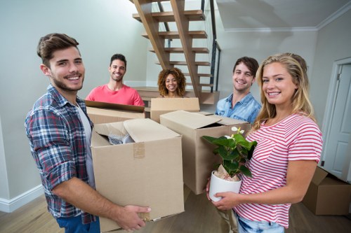 Commercial moving team preparing office equipment for relocation in Acton
