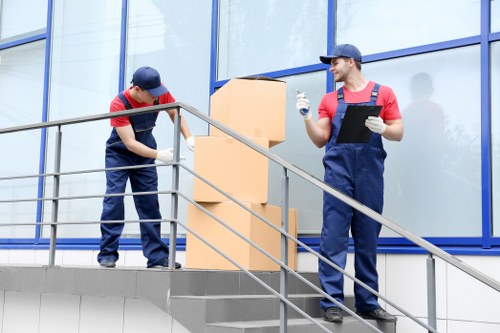 Student removals team handling boxes during an Acton move