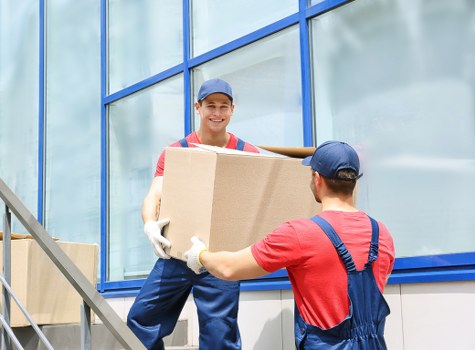 Office furniture and packed boxes ready for a commercial relocation