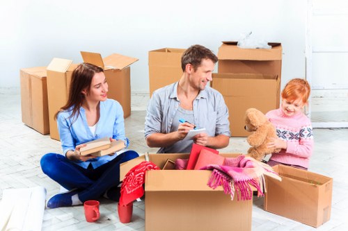 Commercial relocation preparation with labelled boxes and office equipment