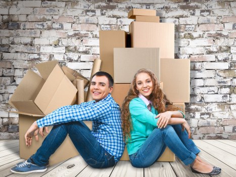 Trained movers using protective equipment during an Acton removal job