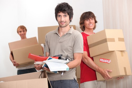 Worker assessing risks before loading items into a removal van