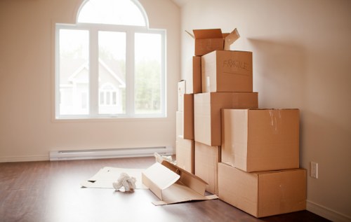 Furniture being carefully carried during a house move in Acton