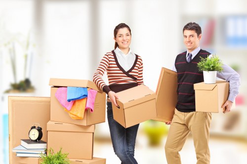Careful moving of household items through a flat stairwell