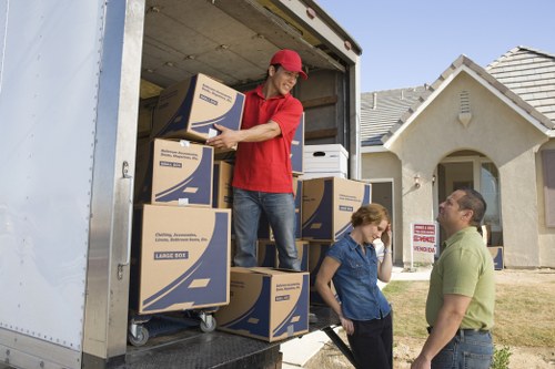 Professional movers handling business contents during an Acton office move