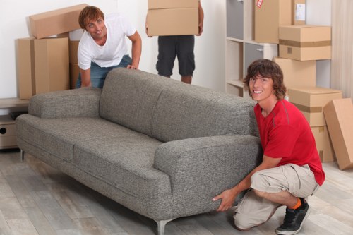 Local removal crew handling desks and equipment in Acton