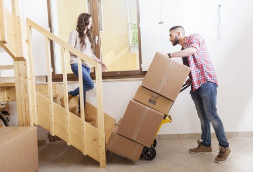 Professional movers loading items for a local Acton relocation