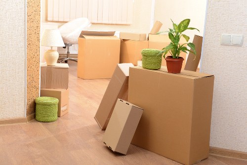 Unpacking and organising belongings in an Acton property