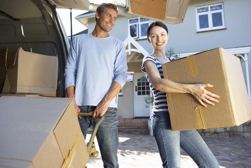 Moving team handling household items during a removal van service