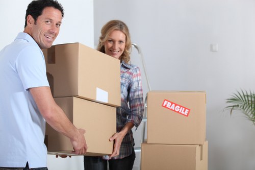 Careful loading of boxes and furniture for a flat move in Acton