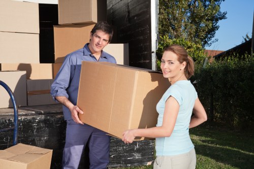 Packed boxes and furniture stored securely for an Acton move